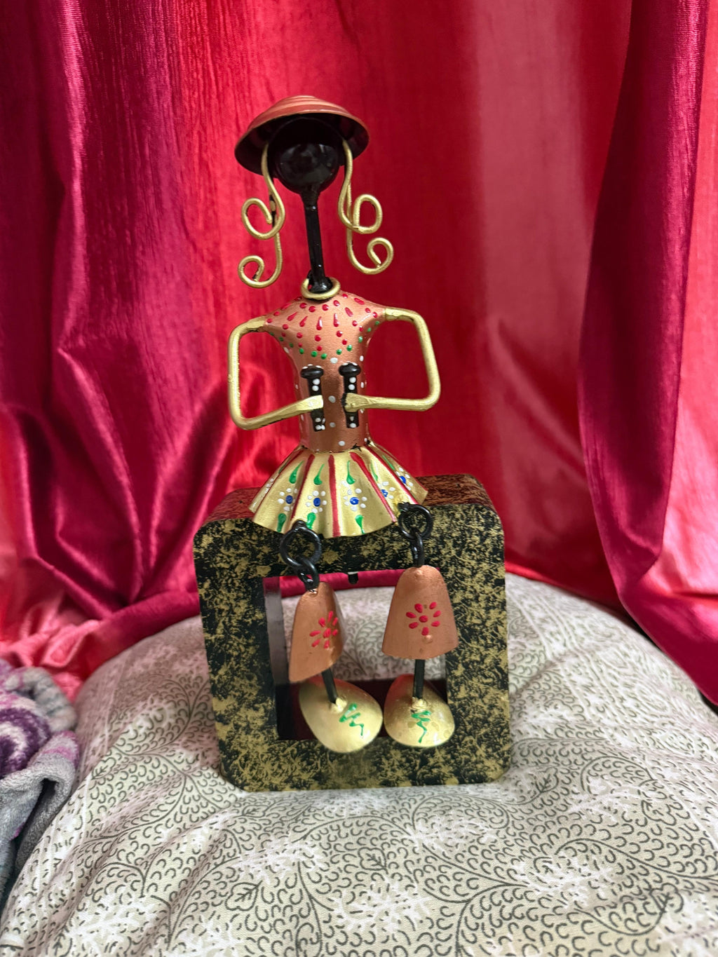 Multi colour metal sitting musician figurine